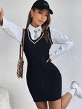 Amelia cable-knit mini sweater dress with V-neck striped trim, layered over a collared shirt and tie, styled with a cap