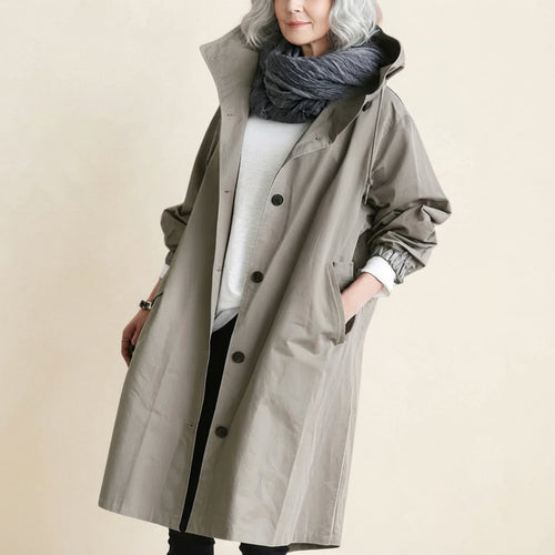 Front view of the Angelika oversized hooded trench coat in grey, featuring a relaxed oversized silhouette, attached hood, long sleeves, and practical front pockets.