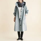 Front view of the Angelika oversized hooded trench coat in light grey, featuring a relaxed oversized silhouette, attached hood, long sleeves, and practical front pockets.