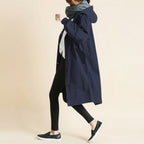 Front view of the Angelika oversized hooded trench coat in navy blue, featuring a relaxed oversized silhouette, attached hood, long sleeves, and practical front pockets.