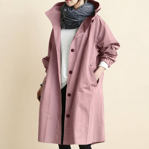 Front view of the Angelika oversized hooded trench coat in pink, featuring a relaxed oversized silhouette, attached hood, long sleeves, and practical front pockets.
