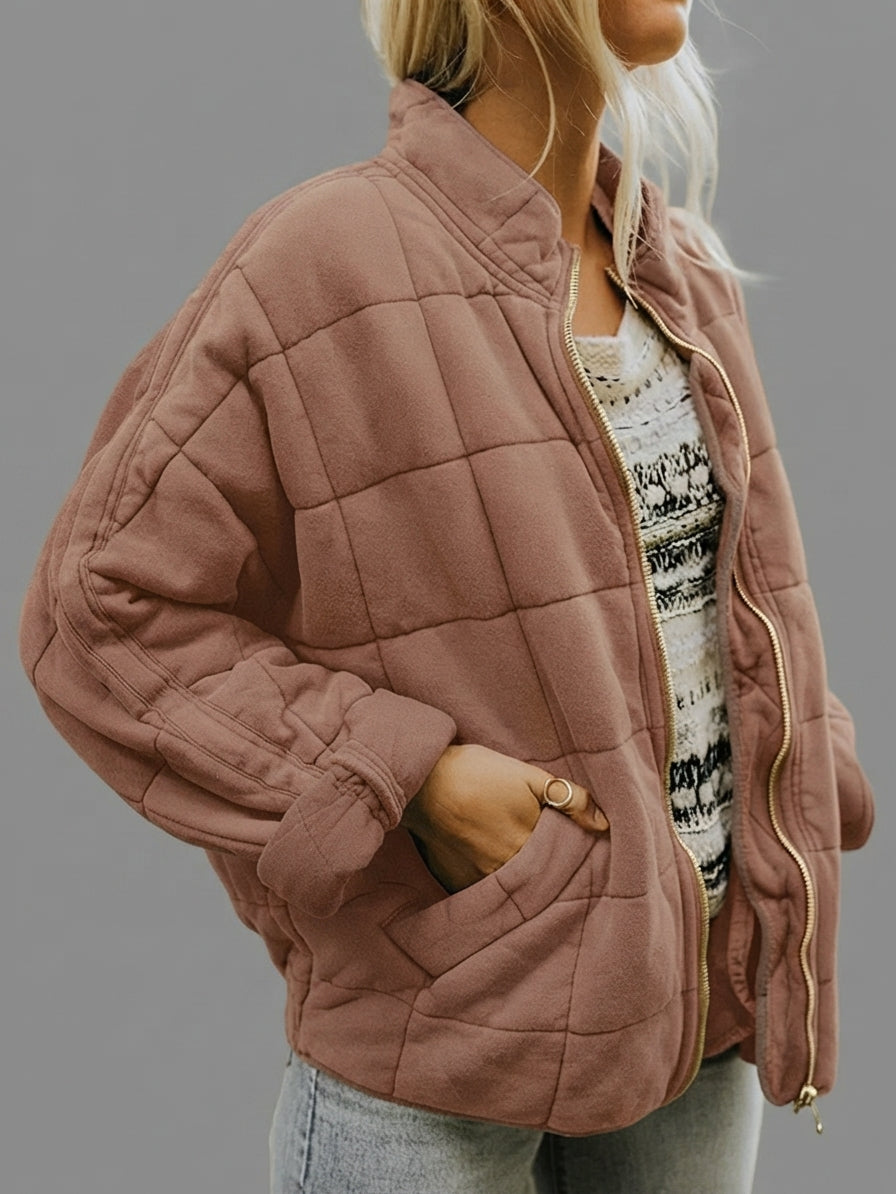 Front view of the Anouska Quilted Jacket in light brown, showcasing its quilted texture, oversized relaxed fit, long sleeves, and stylish everyday design.