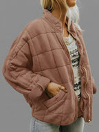 Front view of the Anouska Quilted Jacket in light brown, showcasing its quilted texture, oversized relaxed fit, long sleeves, and stylish everyday design.
