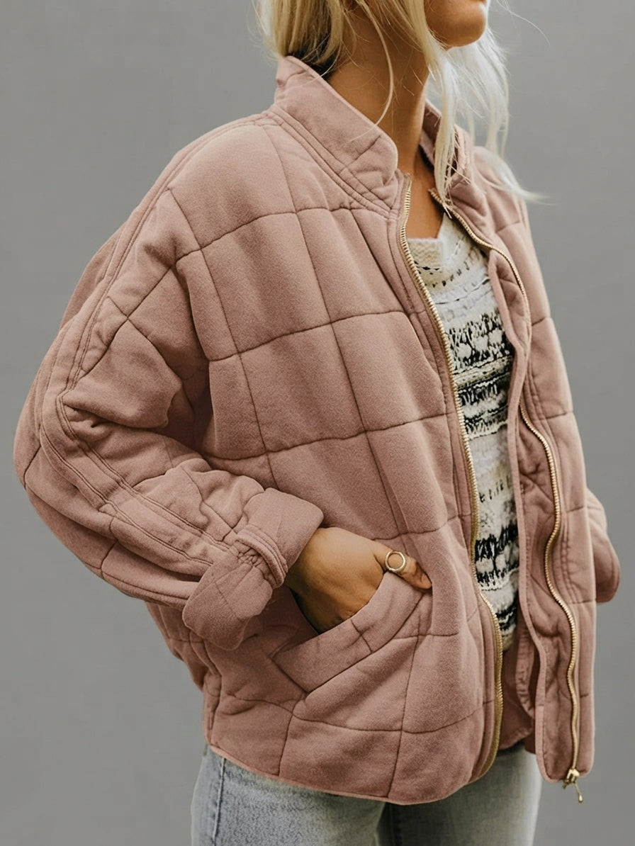 Front view of the Anouska Quilted Jacket in light pink, showcasing its quilted texture, oversized relaxed fit, long sleeves, and stylish everyday design.