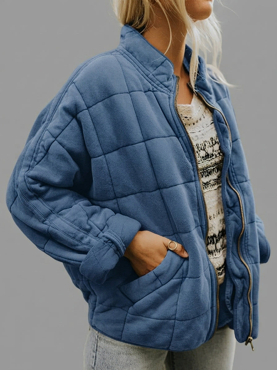 Front view of the Anouska Quilted Jacket in navy blue, showcasing its quilted texture, oversized relaxed fit, long sleeves, and stylish everyday design.