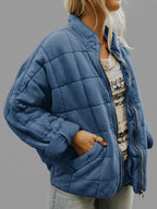 Front view of the Anouska Quilted Jacket in navy blue, showcasing its quilted texture, oversized relaxed fit, long sleeves, and stylish everyday design.