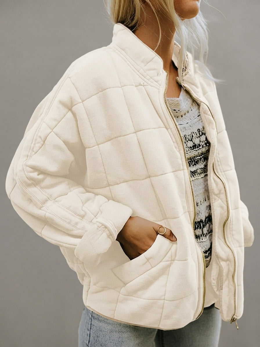 Front view of the Anouska Quilted Jacket in white, showcasing its quilted texture, oversized relaxed fit, long sleeves, and stylish everyday design.