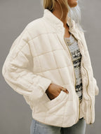 Front view of the Anouska Quilted Jacket in white, showcasing its quilted texture, oversized relaxed fit, long sleeves, and stylish everyday design.