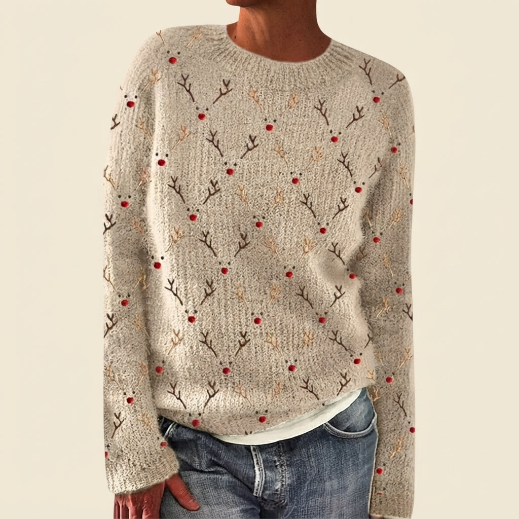 Front view of the beige Béatrix Reindeer-Print Crew-Neck Sweater featuring a festive reindeer print, classic crew neckline, long sleeves, and cozy knit fabric.