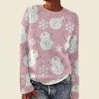 Front view of the pink Béatrix Reindeer-Print Crew-Neck Sweater featuring a festive reindeer print, classic crew neckline, long sleeves, and cozy knit fabric.