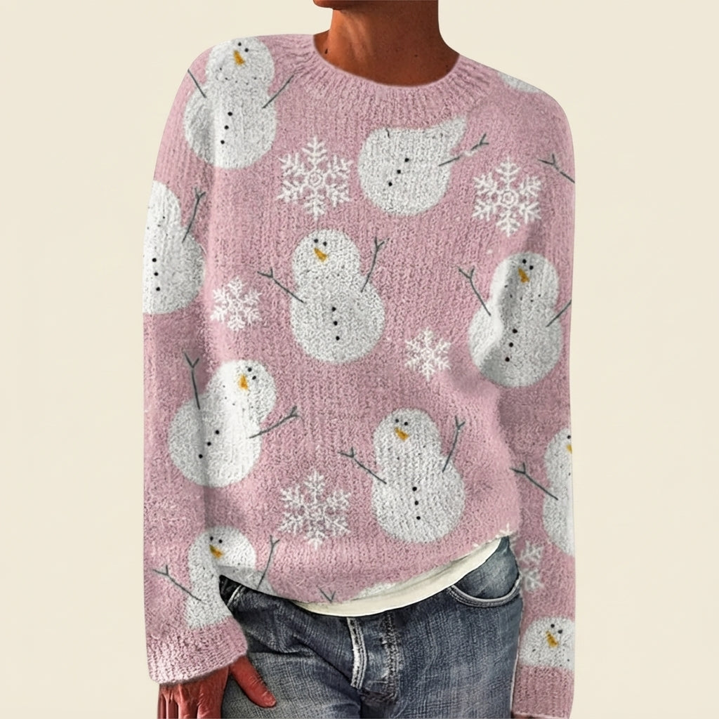 Front view of the pink Béatrix Reindeer-Print Crew-Neck Sweater featuring a festive reindeer print, classic crew neckline, long sleeves, and cozy knit fabric.