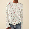 Front view of the white Béatrix Reindeer-Print Crew-Neck Sweater featuring a festive reindeer print, long sleeves, and a cozy knit design.