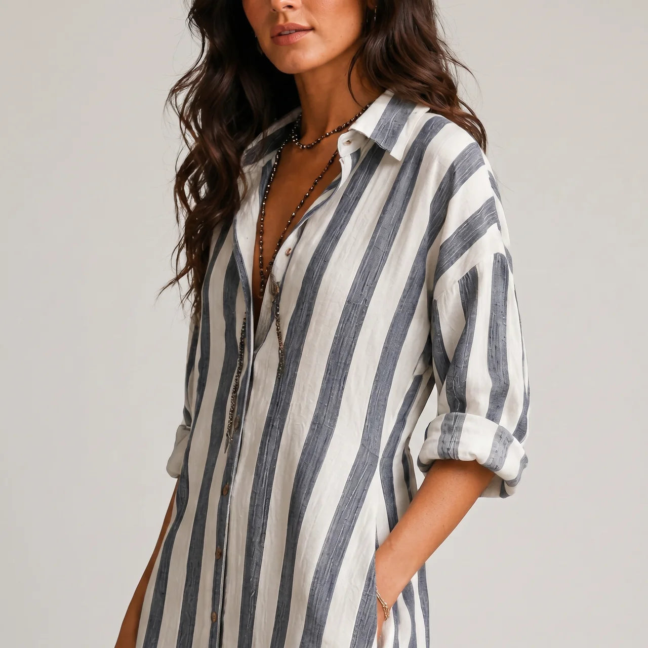 Close-up detail view of blue striped lightweight maxi dress with rolled sleeves and button front BELLA HUDSON