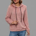 Front close-up view of the Céleste Hoodie Sherpa Drawstring in pink, highlighting the soft sherpa texture, cozy hood, adjustable drawstring, and detailed front design.