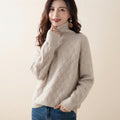 Charlotte Sweater Turtleneck Cable-Knit in beige color, front view, featuring a cozy cable-knit texture, high turtleneck neckline, long sleeves, and relaxed fit.