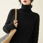 Charlotte Sweater Turtleneck Cable-Knit in black color, front view, featuring a cozy cable-knit texture, high turtleneck neckline, long sleeves, and relaxed fit.