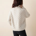 Charlotte Sweater Turtleneck Cable-Knit in cream color, back side view, showcasing the cozy cable-knit texture, high turtleneck neckline, long sleeves, and relaxed fit.