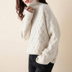 Charlotte Sweater Turtleneck Cable-Knit in cream color, front view, featuring a cozy cable-knit texture, high turtleneck neckline, long sleeves, and relaxed fit.