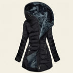 Front view showcasing the Clara puffer jacket in black, featuring a cozy faux-fur-lined hood, quilted body, full-zip front closure, long sleeves, and a comfortable cold-weather fit.