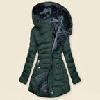 Front view showcasing the Clara puffer jacket in dark green, featuring a cozy faux-fur-lined hood, quilted body, full-zip front closure, long sleeves, and a warm, comfortable silhouette.