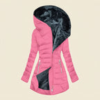 Front view showcasing the Clara puffer jacket in pink, featuring a cozy faux-fur-lined hood, quilted body, full-zip front closure, long sleeves, and a warm, comfortable silhouette.