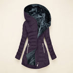 Front view showcasing the Clara puffer jacket in purple, featuring a cozy faux-fur-lined hood, quilted body, full-zip front closure, long sleeves, and a warm, comfortable silhouette.