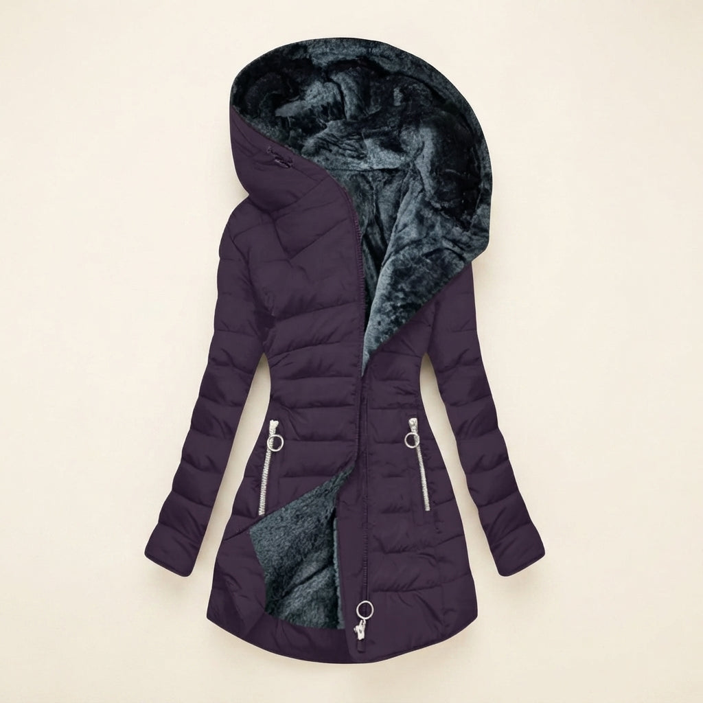 Front view showcasing the Clara puffer jacket in purple, featuring a cozy faux-fur-lined hood, quilted body, full-zip front closure, long sleeves, and a warm, comfortable silhouette.