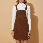 Front view of the chestnut brown Elodie Corduroy Pinafore Mini Dress featuring ribbed texture, adjustable straps, and straight fit.