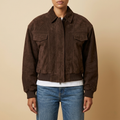 Front view of the brown Elodie Suede-Look Cropped Long-Sleeve Jacket featuring a point collar, zip front, and chest pocket.