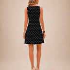Fionnuala black polka-dot mini dress, back view, designed by Bella Hudson