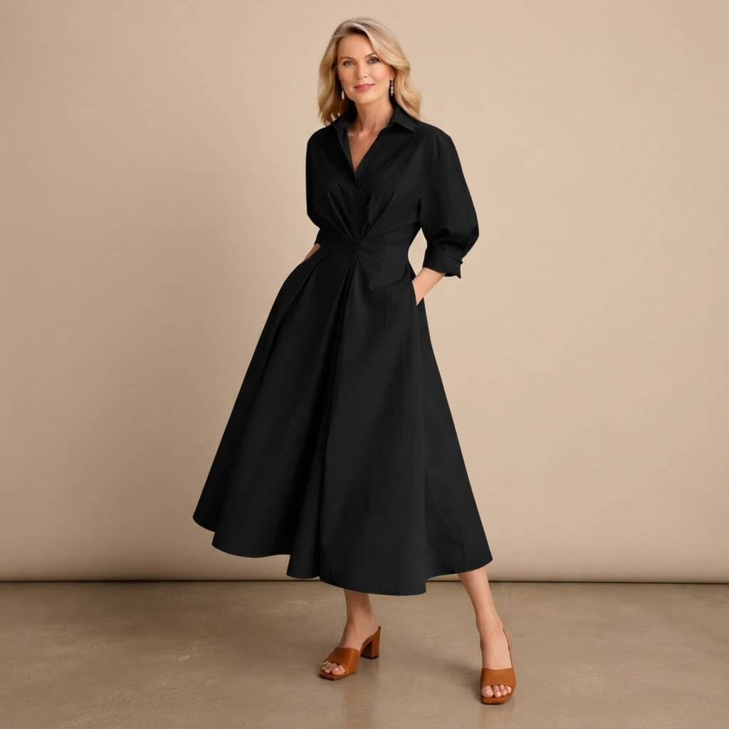 Genevra Breeze Flow Maxi Dress Wrap-Front Collared in Black shown in front view with a wrap-front design, collared neckline, and flowing maxi silhouette.