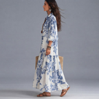 Ines Floral-Print Tiered Button-Down Maxi Dress in White and Blue shown in side view with tiered skirt.
