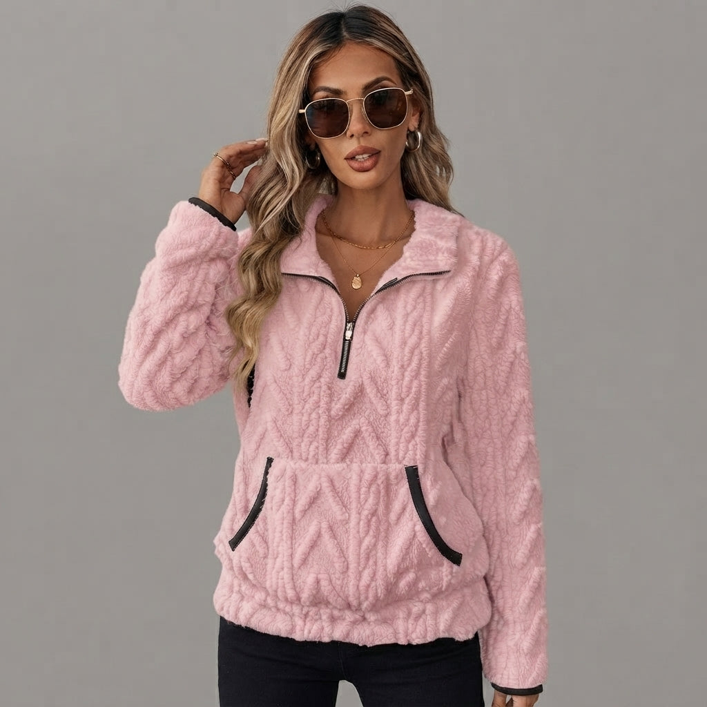 Pink fleece top with a cozy half-zip neckline, shown from the front.