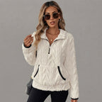 White fleece pullover with a half-zip collar, photographed from the front.