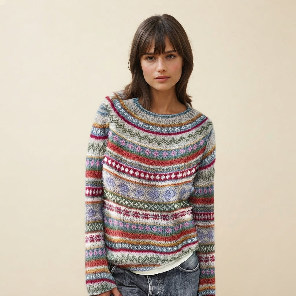 Front view of the Isaure Sweater Striped Crew-Neck featuring a stylish multi-color striped pattern, classic crew neckline, long sleeves, and a soft knit design. The vibrant combination of colors adds a playful yet versatile touch to everyday outfits.