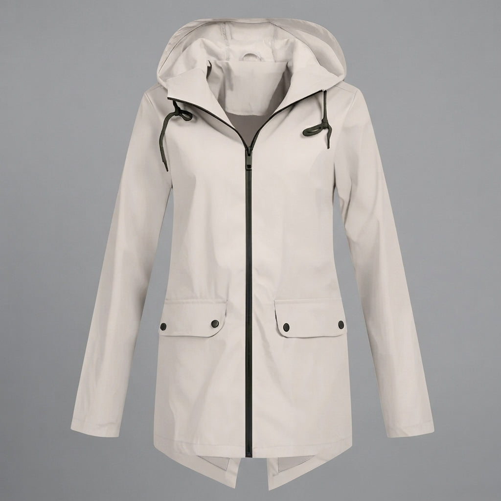 Front view of the Julia Rain Jacket in a soft cream color, featuring an attached hood, full zip-front closure, long sleeves, and practical front pockets. The lightweight design offers a clean, versatile look for rainy days, outdoor activities, travel, and everyday wear.