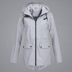 Front view of the Julia Rain Jacket Hooded Zip-Front in a versatile gray color, highlighting the hooded design, full zip-front closure, long sleeves, and clean lightweight silhouette.