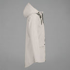 Side view of the Julia Rain Jacket featuring a soft cream color, attached hood, full zip-front closure, long sleeves, and practical front pockets. The lightweight design offers a clean, versatile look for rainy days, outdoor activities, travel, and everyday wear.