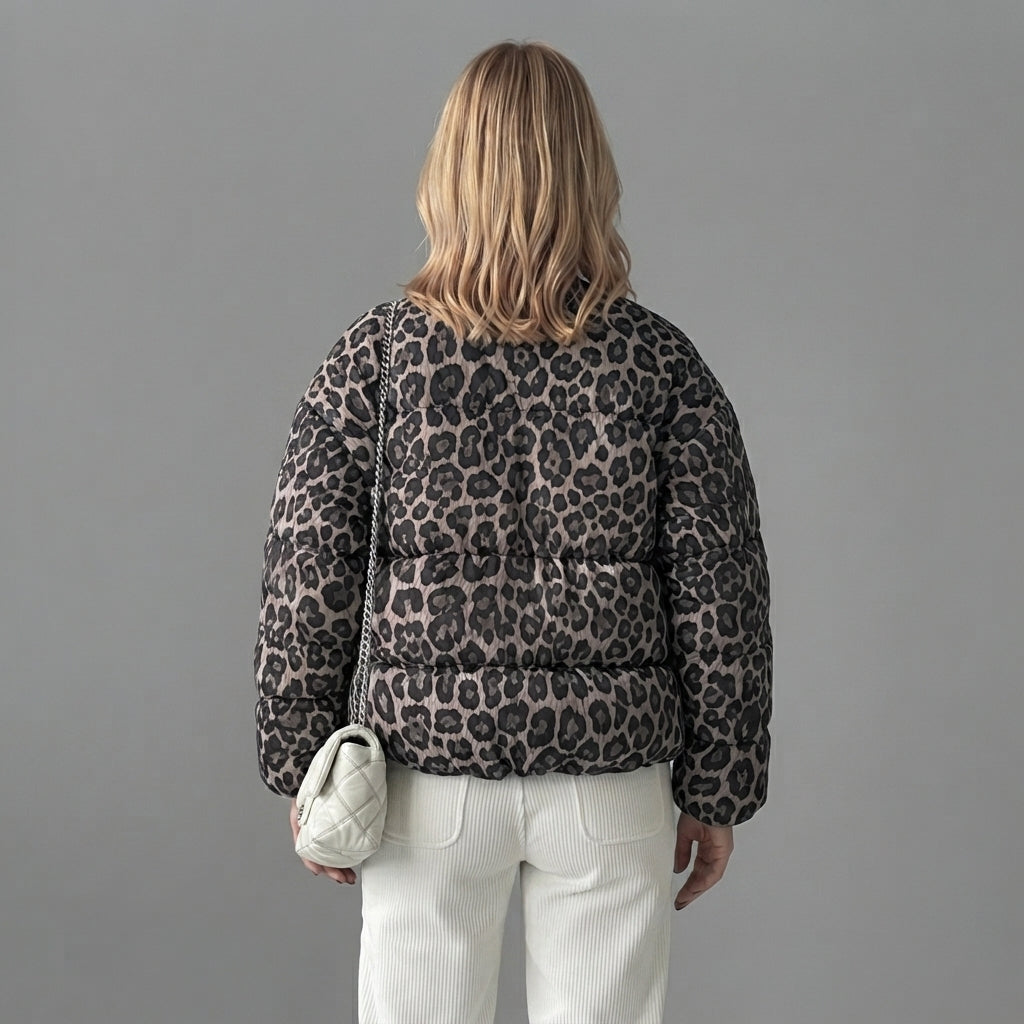 Back view of the Odalie Bomber Jacket in dark brown featuring an all-over leopard-print pattern, classic bomber silhouette, long sleeves, and relaxed fit.