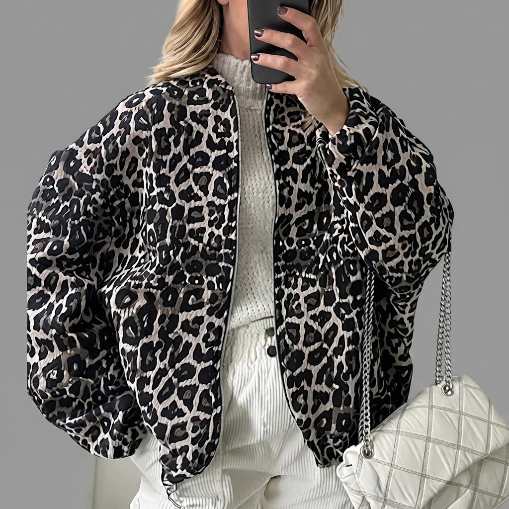 Front view of the Odalie Bomber Jacket in dark brown featuring a bold leopard-print pattern, classic bomber silhouette, long sleeves, and front zip closure.
