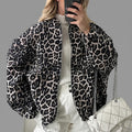 Front view of the Odalie Bomber Jacket in dark brown featuring a bold leopard-print pattern, classic bomber silhouette, long sleeves, and front zip closure.