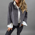 Rosamée grey wool-blend button-front jacket shown from the front view, featuring a classic button-front closure, long sleeves, practical front pockets, and a comfortable timeless silhouette.