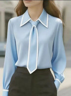 Charlotte Sky Blue collared blouse with contrast piping, tie detail, and long sleeves