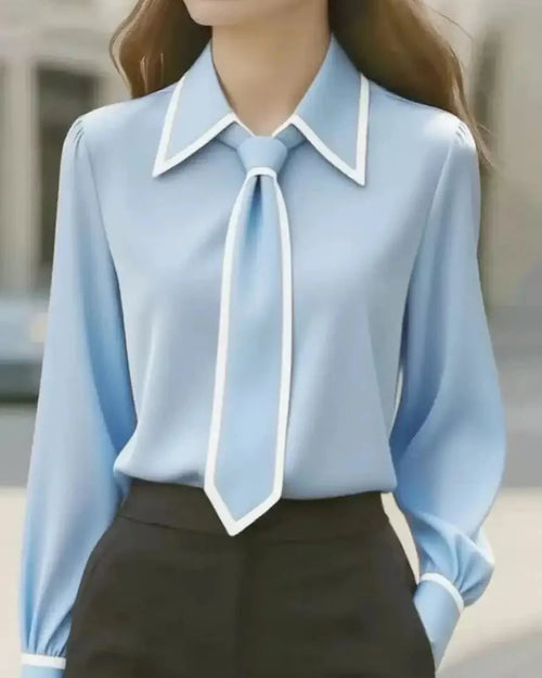 Charlotte Sky Blue collared blouse with contrast piping, tie detail, and long sleeves