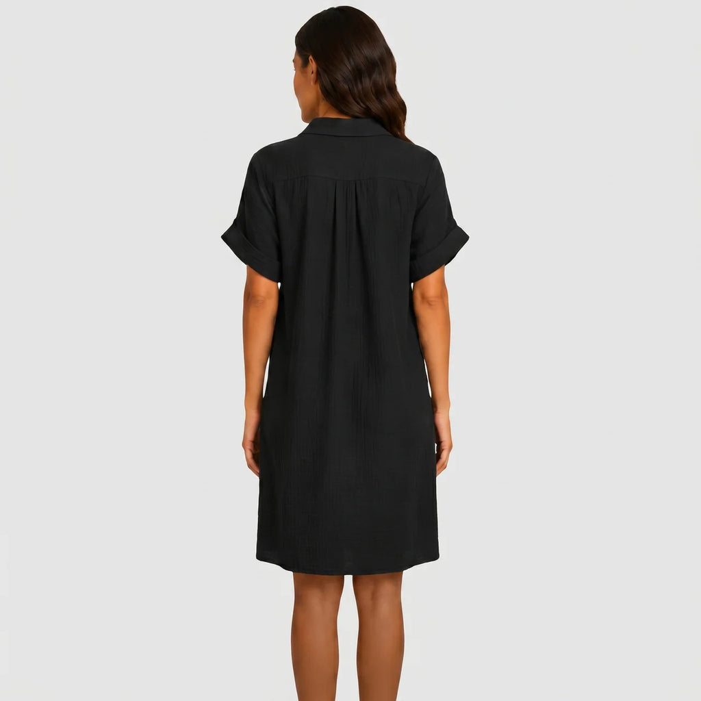 Back view of black button front midi dress with short sleeves and side pockets by BELLA HUDSON