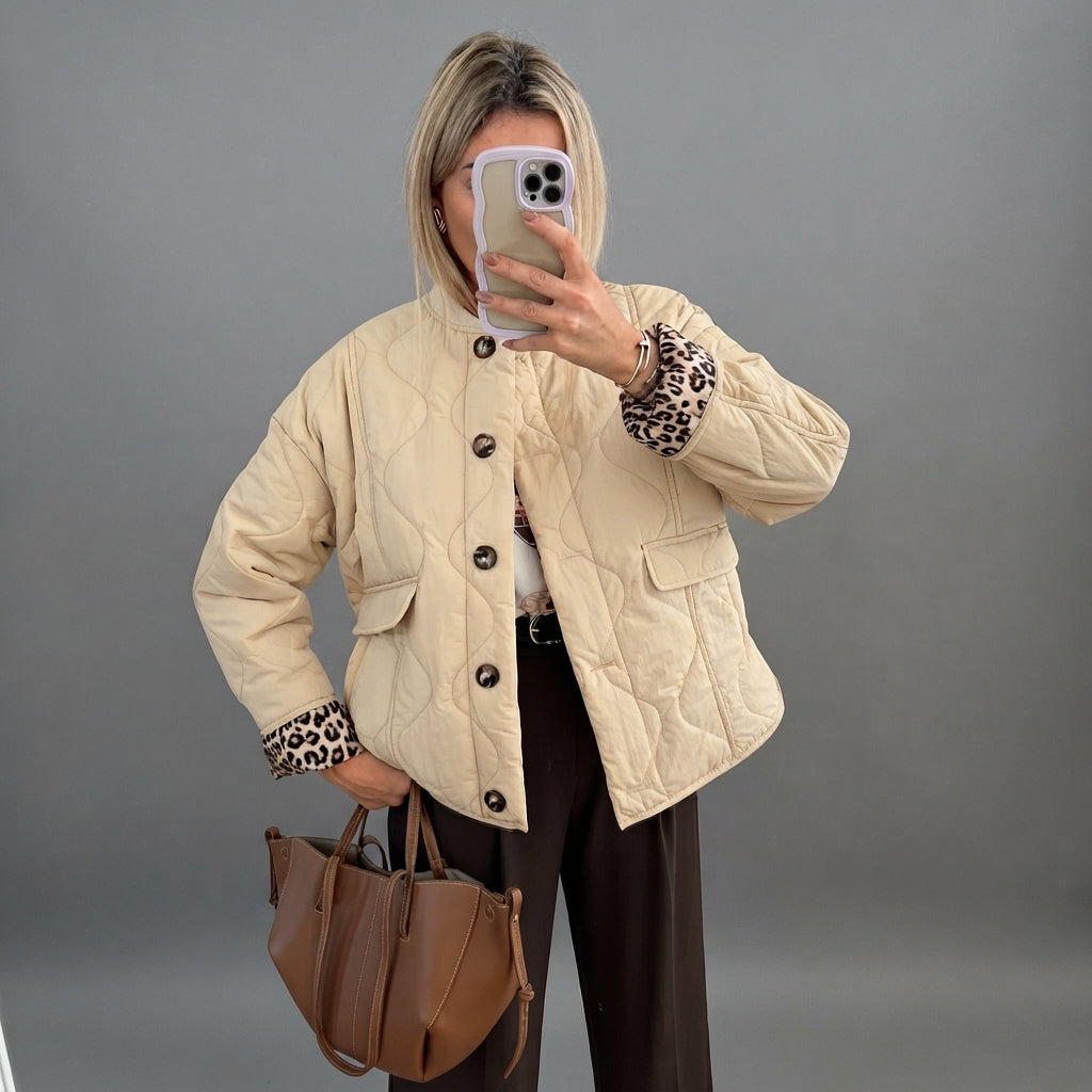 Front view of the Sylvaine Jacket Quilted Leopard-Trim in beige, featuring a quilted design, stylish leopard-print trim, and a comfortable everyday silhouette.