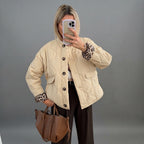 Front view of the Sylvaine Jacket Quilted Leopard-Trim in beige, featuring a quilted design, stylish leopard-print trim, and a comfortable everyday silhouette.
