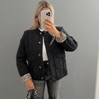 Front view of the Sylvaine Jacket Quilted Leopard-Trim in black, featuring a quilted design with stylish leopard-print trim and a comfortable everyday silhouette.