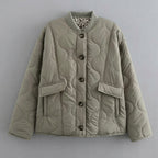 Front view of the Sylvaine Jacket Quilted Leopard-Trim in grey, featuring a quilted design, stylish leopard-print trim, and a comfortable everyday silhouette.