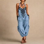 Théa Lightweight Embroidered Bohemian Jumpsuit in Blue shown in front view with embroidered details and a relaxed silhouette.
